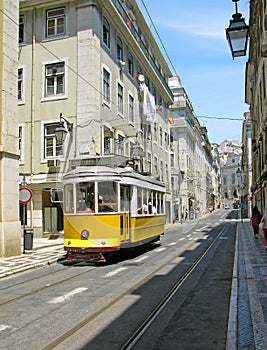 Old yellow tram in Lisbon downtown