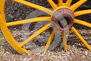 Old yellow wagon wheel