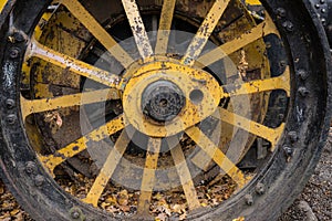 Old yellow wheel of construction machine