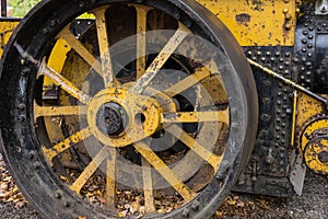 Old yellow wheel of construction machine