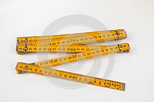old yellow wooden meter on white background