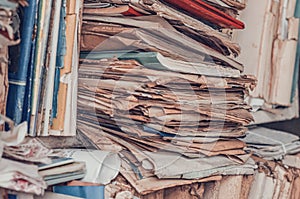 Old yellowed papers, documents on the shelves