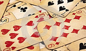 Old yellowed poker cards. background or texture