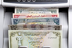 Old Yemeni rial in a counting machine