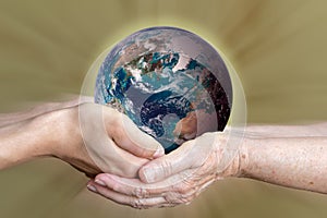 old and young person hands holding planet earth, unity concept. elements of this images furnished by nasa