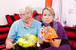 Old and young woman getting improper gifts