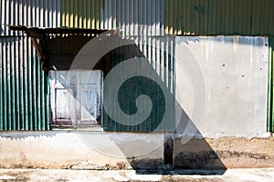 Old zinc and concrete wall of ancient house