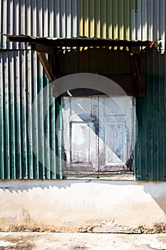 Old zinc and concrete wall of ancient house