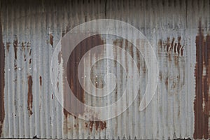 Old zing wall,background of peeling paint and rusty old metal.zinc wall texture pattern background rusty corrugated metal old