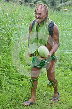 Olde aged Pacific Islander man carry a watermelon on eco tourism