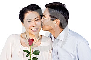 Older asian couple with rose