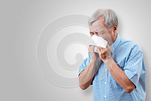 Older asian man is having flu and sneezing from sickness seasonal virus problem
