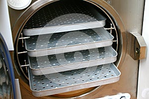 Older autoclave chamber with stainless shelves