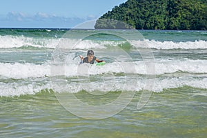 Older boy swimming in Maracas Bay Beach Trinidad