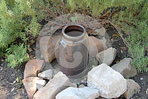 An older broken pot on the ground