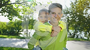 Older Brother Carrying Younger on Back