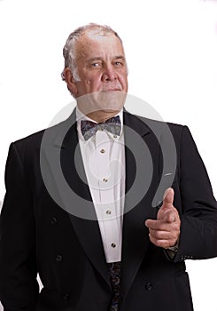 Older businessman impersonating James Bond