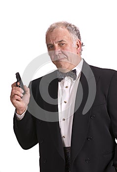 Older businessman impersonating James Bond
