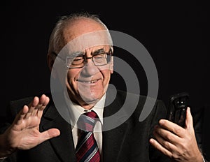 Older businessman with smart phone