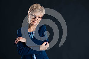 Older businesswoman having elbow pain