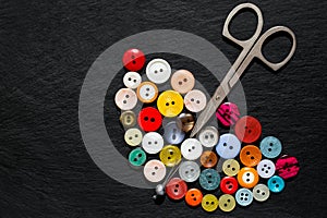 Older buttons and scissors in the form of an umbrella