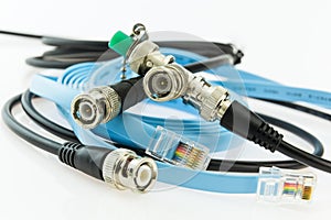 older coaxial ethernet cable with BNC terminals and new with RJ45 connectors photo