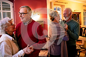 Older couple dancing in the room