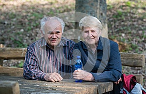 Older couple sitting on a bench