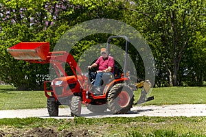 Older Farmer Getting Ready To Plow His Garden
