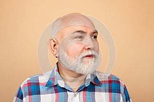 Older grandfather, grandpa pensioner, retiree concept. Elderly caucasian old man face. Portrait of an mature senior man