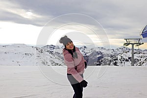 Older latin woman happy to meet the snow