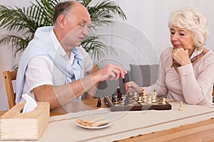 Older man and checkmate in chess