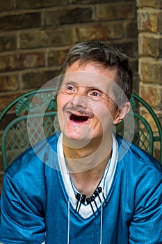 Older Man With Downs Syndrome and No Teeth Delightful Smile photo