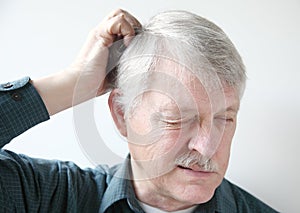 Older man with dry scalp