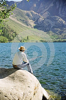 Older Man Fishing at Lake