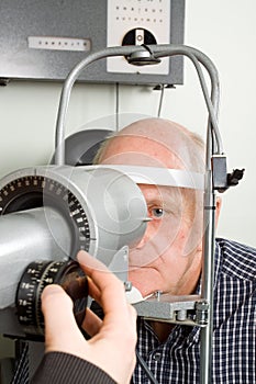 Older man having eye examination photo