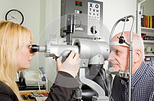 Older man having eye examination photo