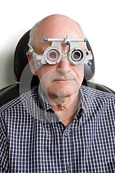 Older man having eye examination photo