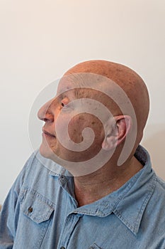 Older man head in profile, bald, alopecia, chemotherapy, cancer, on white