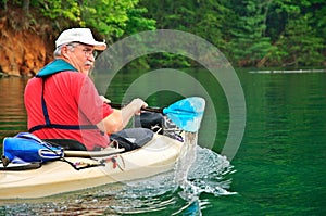 Older Man Kayaking photo