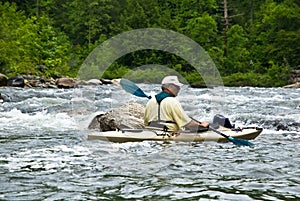 Older Man Kayaking/River Rapids