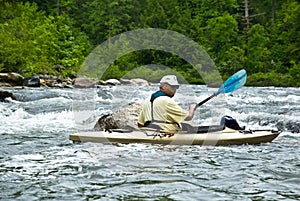 Older Man Kayaking/River Rapids photo