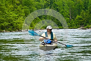 Older Man Kayaking/River Rapids photo