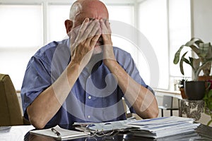 Older man paying bills photo