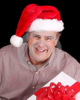 Older man with Santa hat and present