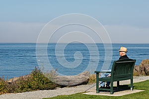 Older Man Sitting Looking Out to Sea