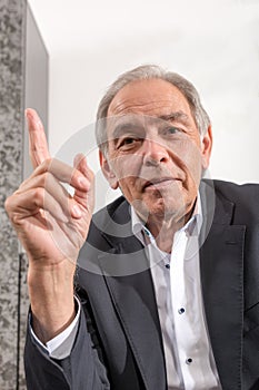 Older man threatens his finger