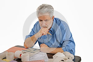 Older Man Works On Taxes REVISED photo