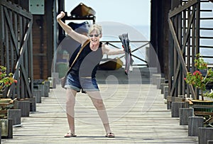 Older mature woman excited on island resort to go scuba diving for first time photo