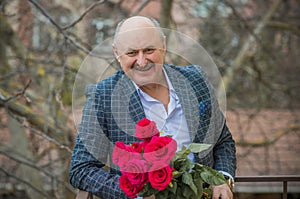 Older men with bouquet of roses, lifestyle of old men